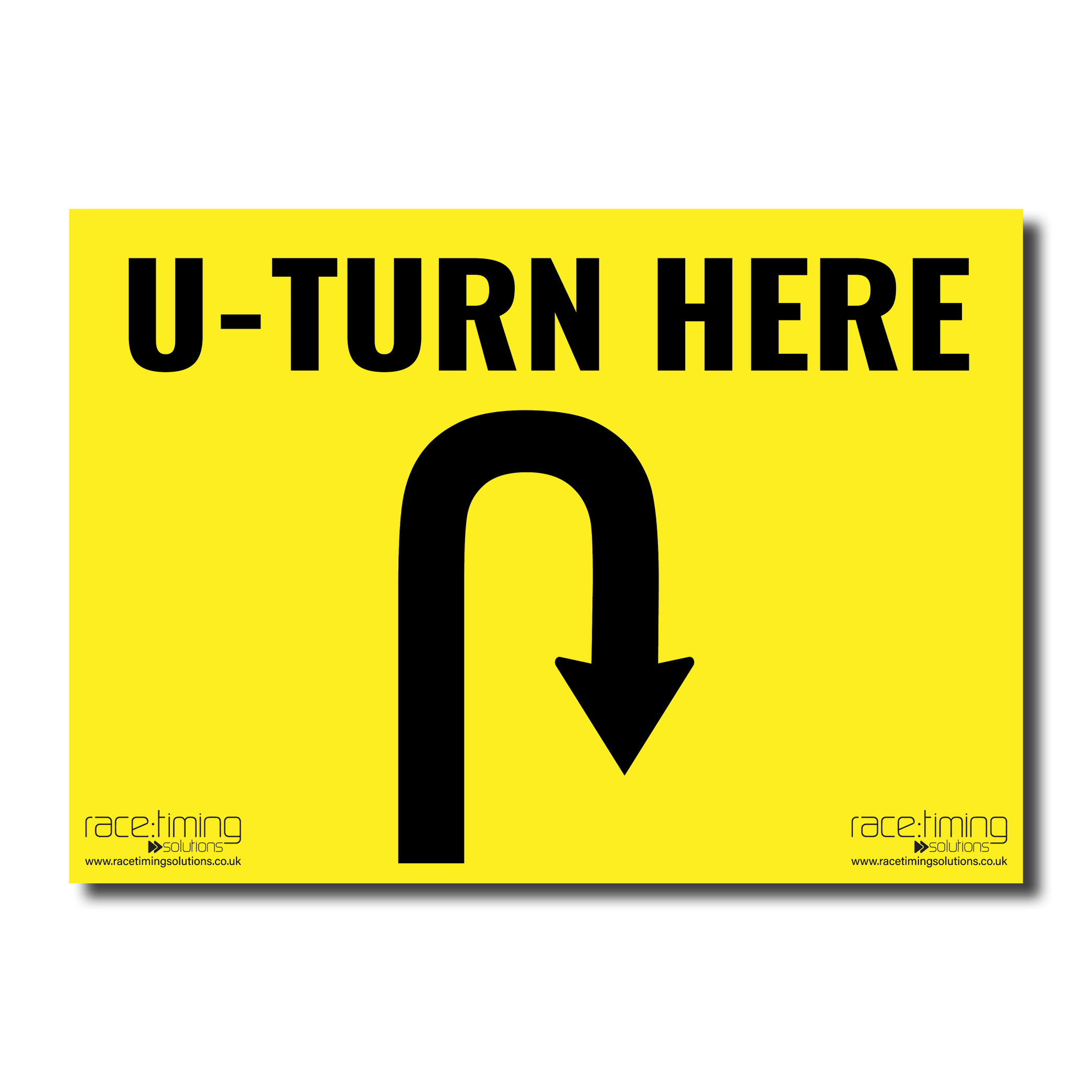 Yellow sign with black 'U-TURN HERE' text and an arrow curving to the right