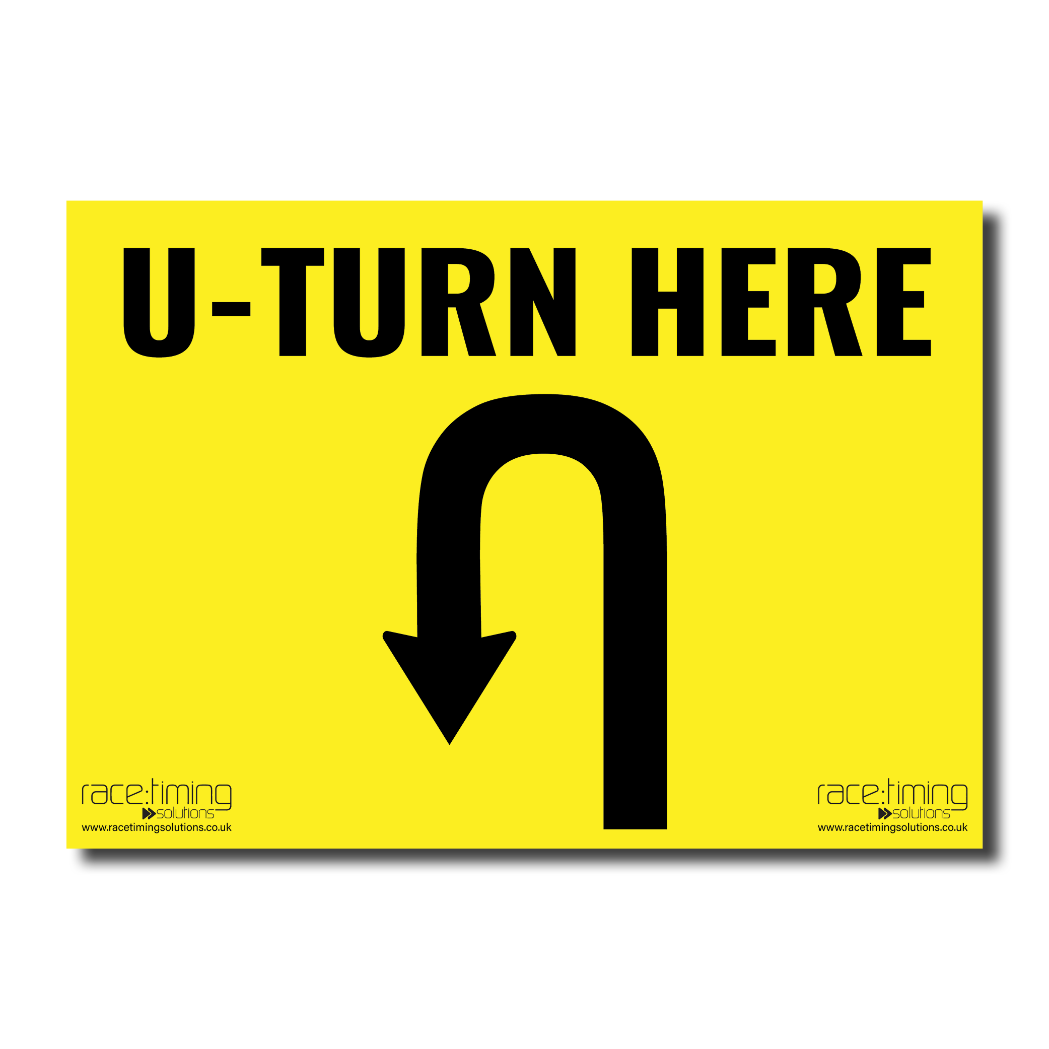 Yellow sign with black 'U-TURN HERE' text and an arrow curving to the left