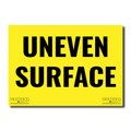 Yellow sign with black text 'UNEVEN SURFACE' 